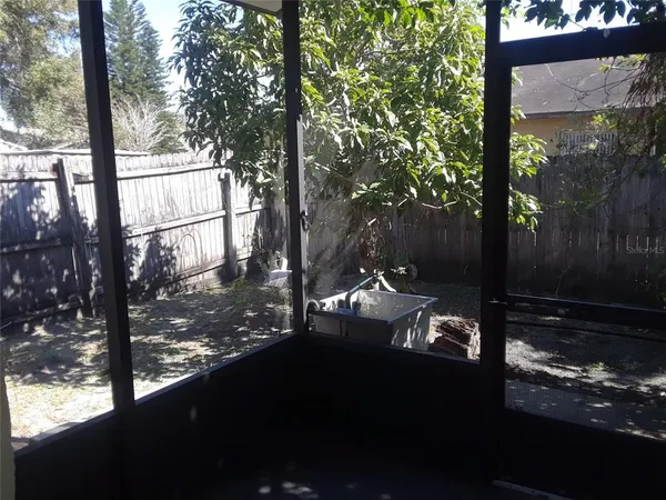 a view of a yard from a balcony