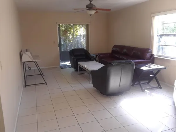 a living room with furniture and a window