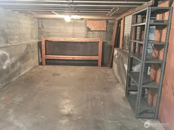 a view of an empty room with a fireplace