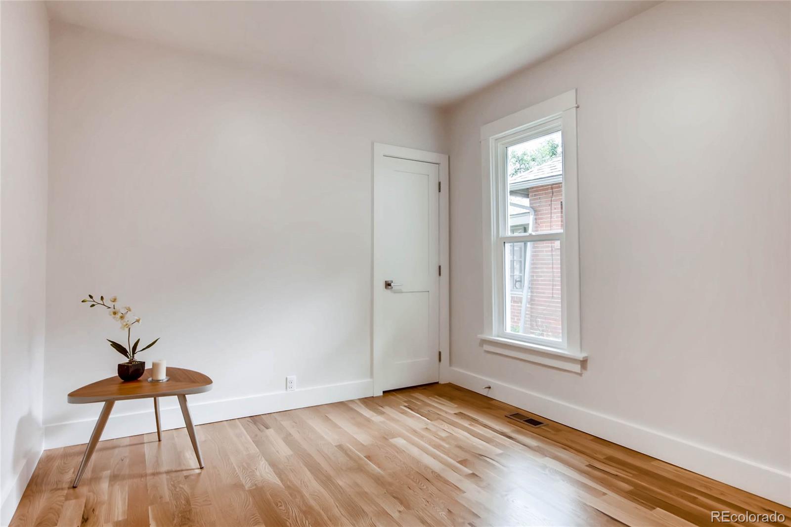 2136 Lowell Boulevard Denver, CO 80211 - Photo 12 of 23 an empty room with windows and closet