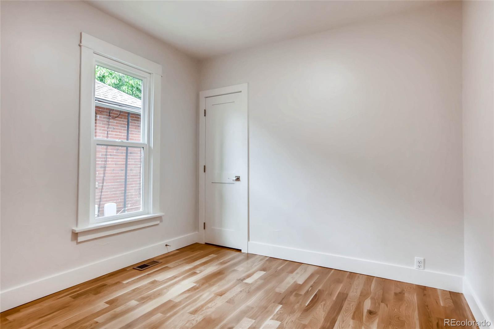 2136 Lowell Boulevard Denver, CO 80211 - Photo 13 of 23 an empty room with window