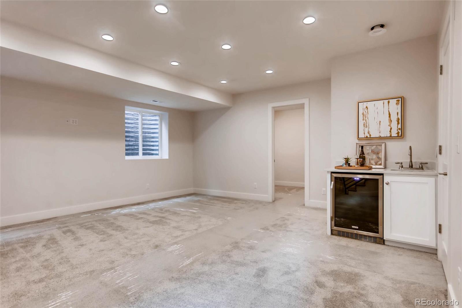 2136 Lowell Boulevard Denver, CO 80211 - Photo 17 of 23 a view of a kitchen and front door