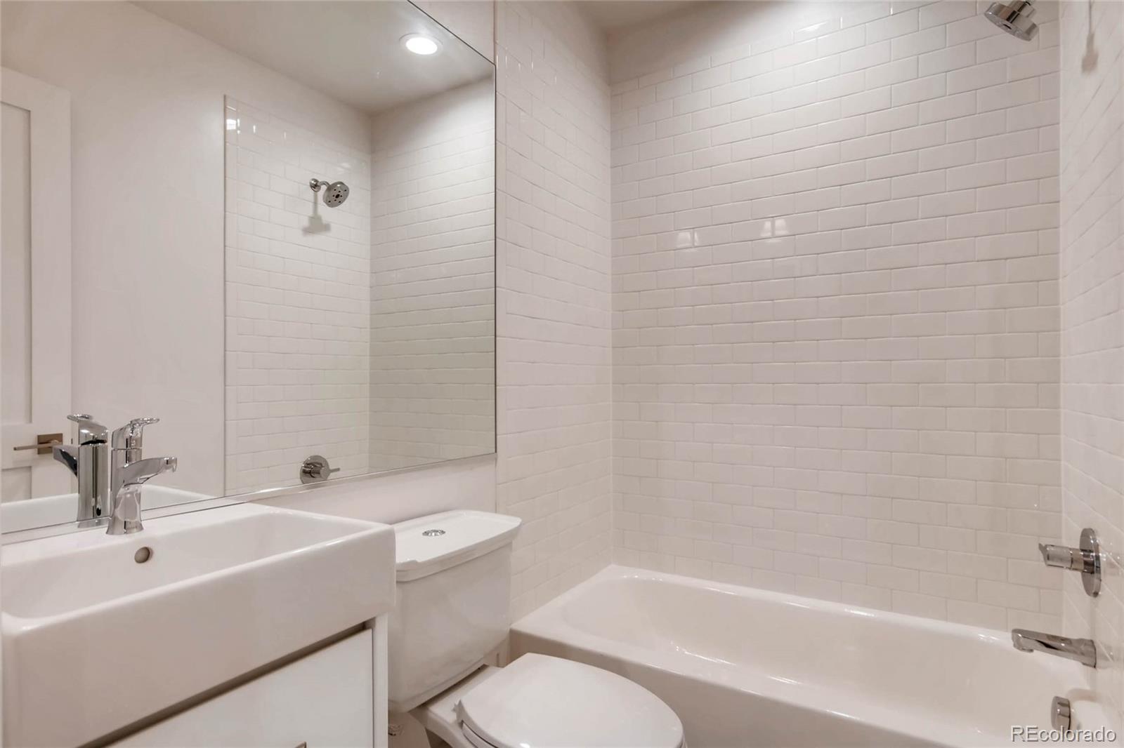 2136 Lowell Boulevard Denver, CO 80211 - Photo 19 of 23 a bathroom with a sink toilet and shower