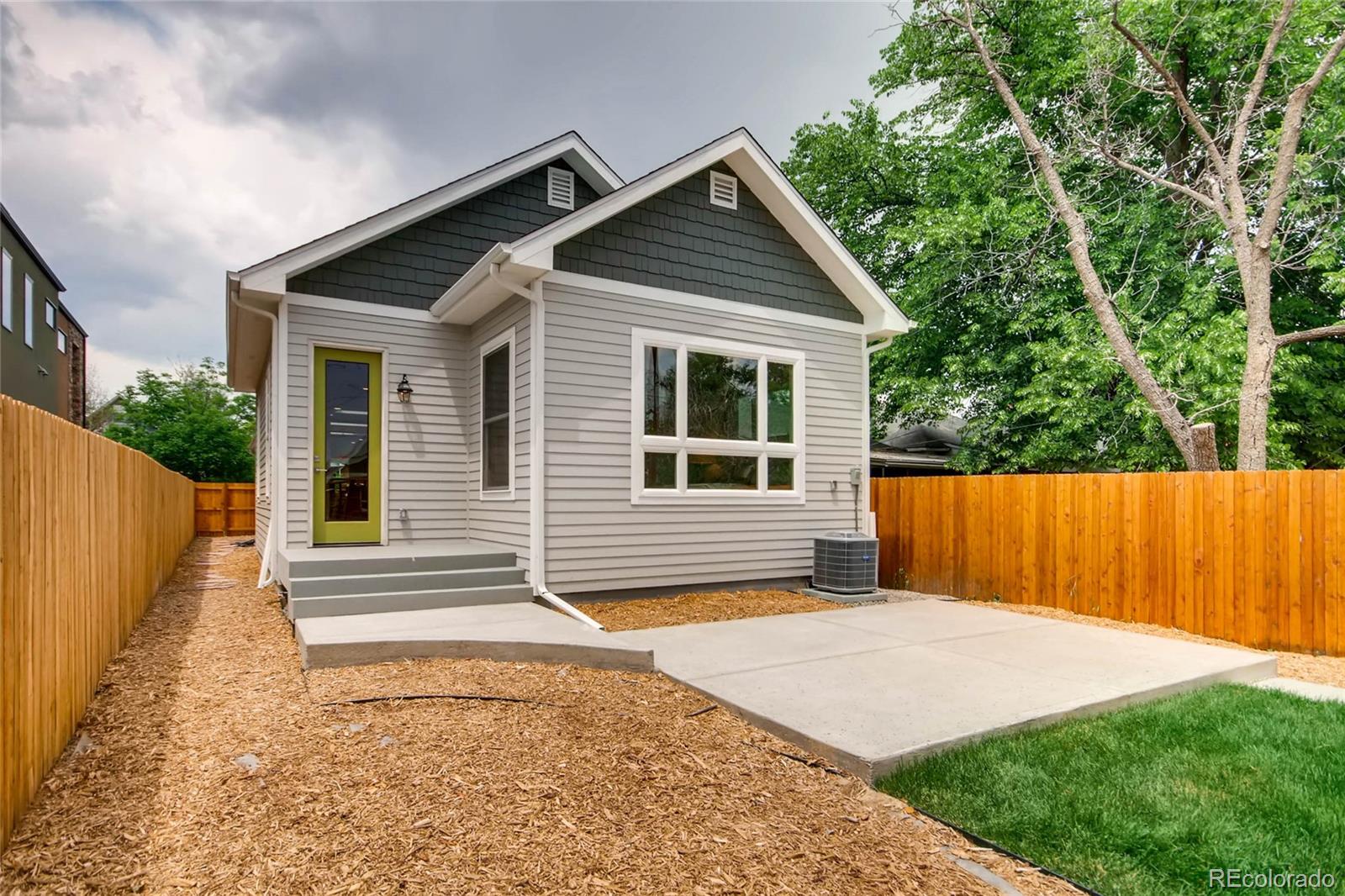 2136 Lowell Boulevard Denver, CO 80211 - Photo 21 of 23 a view of backyard with wooden fence and large trees