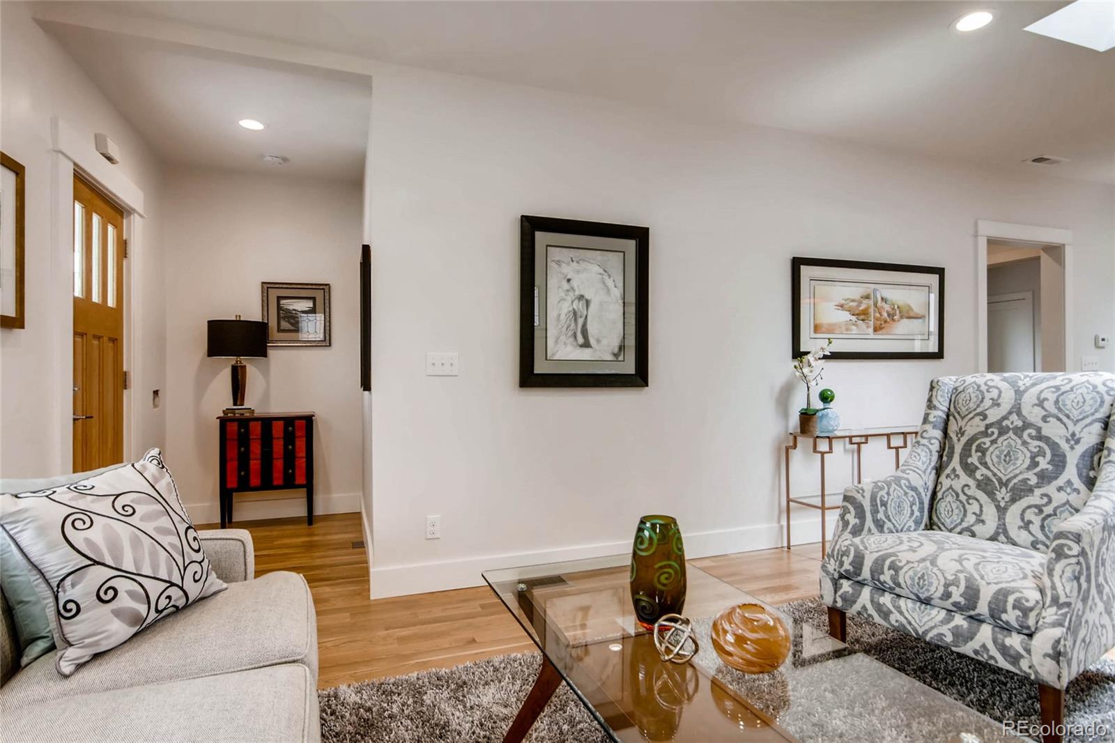 2136 Lowell Boulevard Denver, CO 80211 - Photo 3 of 23 a living room with furniture and a couch