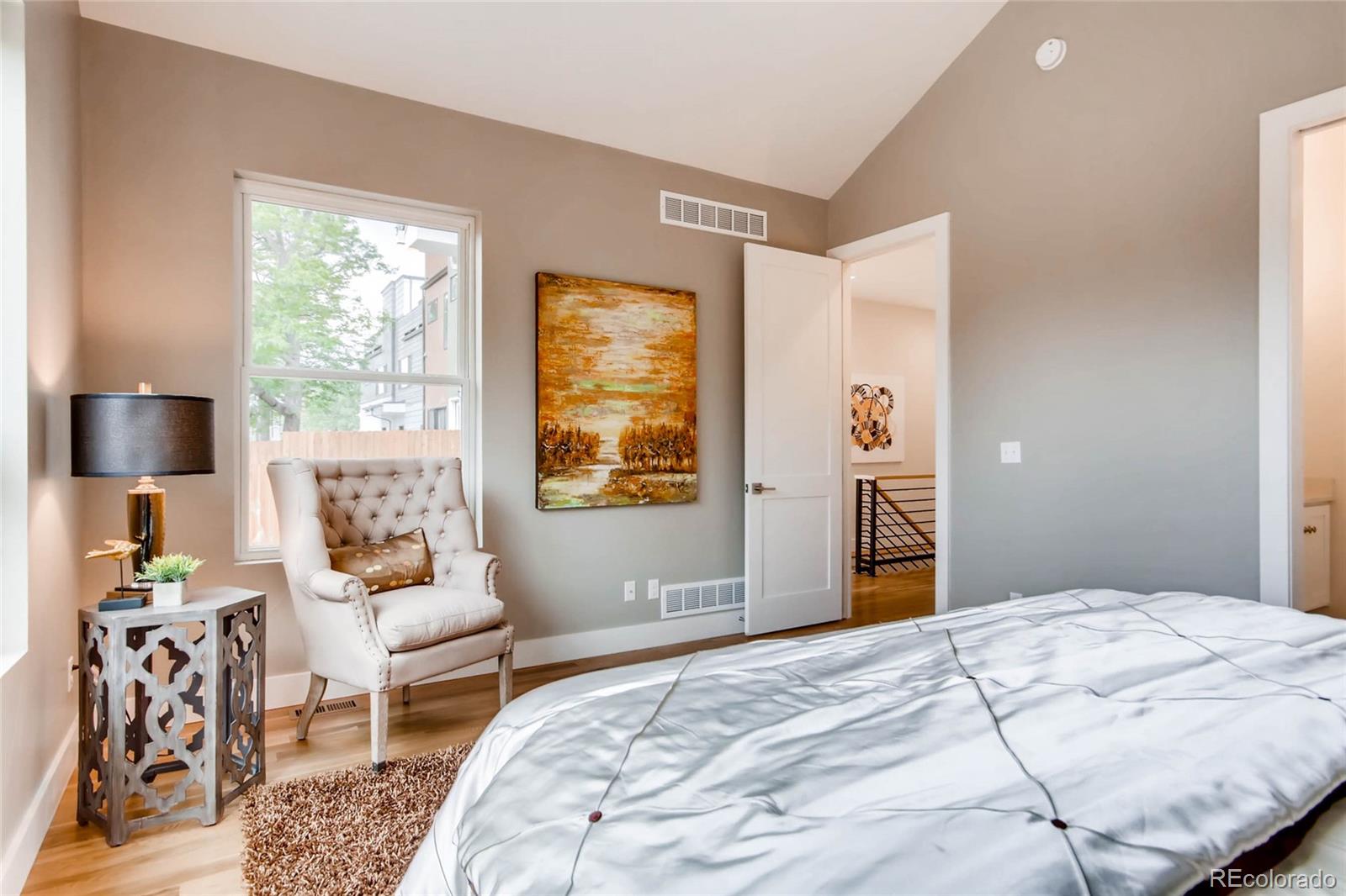 2136 Lowell Boulevard Denver, CO 80211 - Photo 9 of 23 a bedroom with a bed and a couch