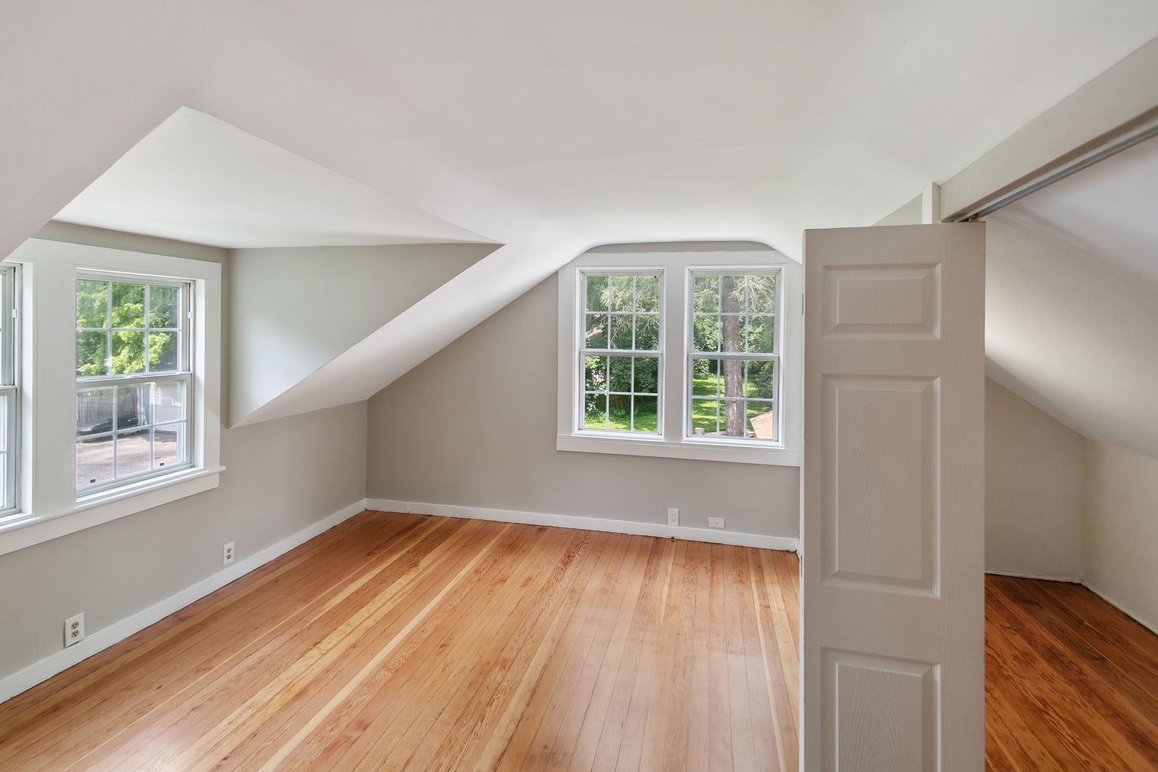 345 Main Street Batavia, IL 60510 - Photo 20 of 25 a view of an empty room with wooden floor and a window