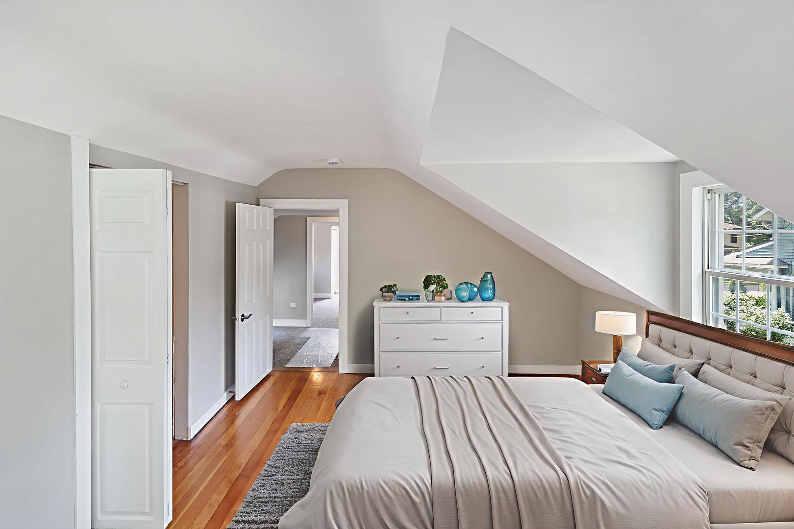 345 Main Street Batavia, IL 60510 - Photo 21 of 25 a bedroom with a bed and a window