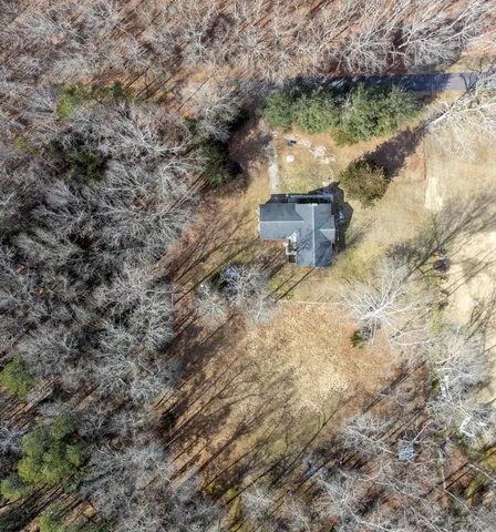 a view of a yard with a tree