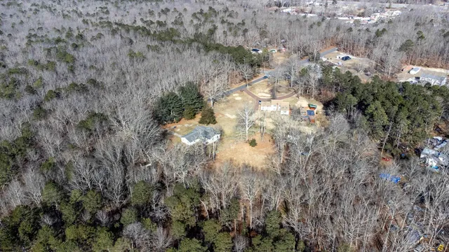 a view of a yard with wooden fence