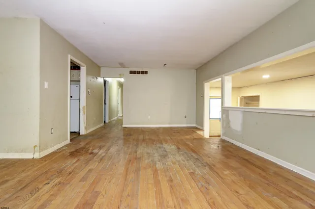 a view of a livingroom with wooden floor