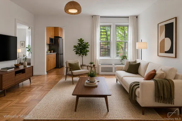 a living room with furniture potted plant and a window