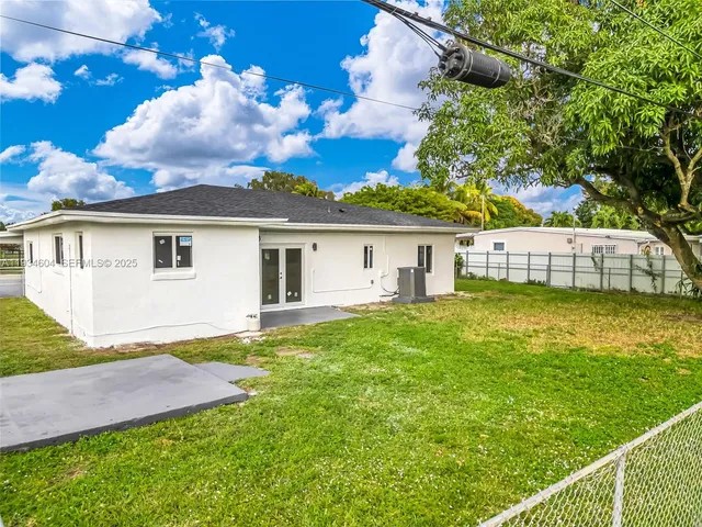 an aerial view of a house with outdoor space