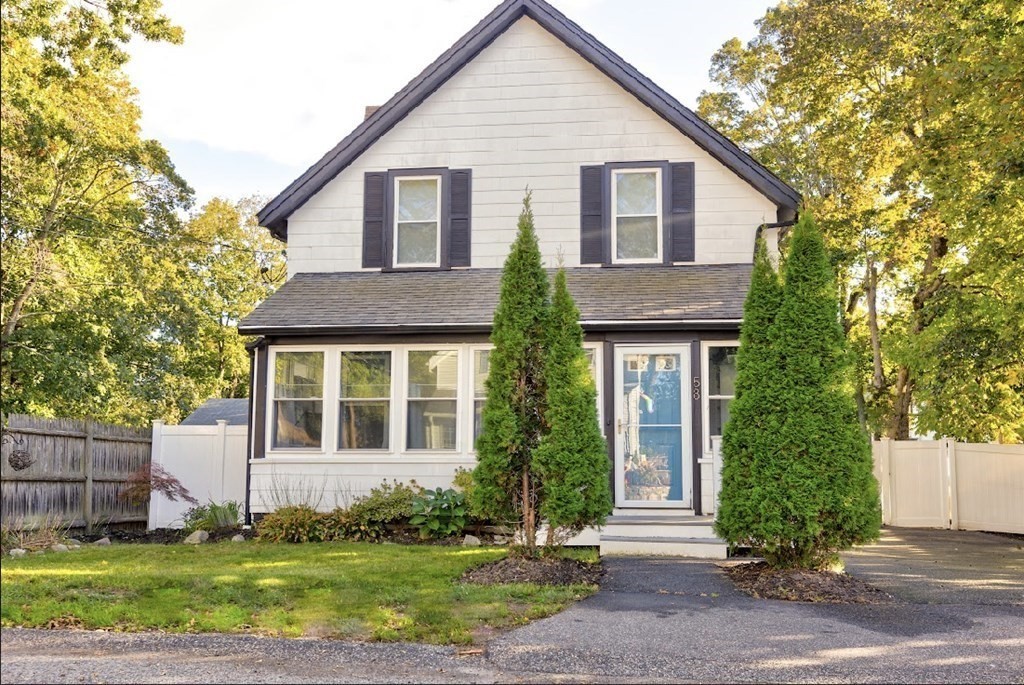58 Waldo Street Dedham, MA 02026 - Photo 1 of 39 a front view of a house with a yard