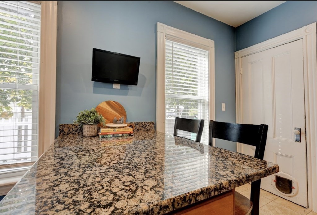 58 Waldo Street Dedham, MA 02026 - Photo 13 of 39 a living room with furniture and a flat screen tv