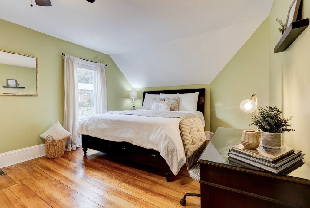 58 Waldo Street Dedham, MA 02026 - Photo 17 of 39 a bedroom with a bed and wooden floor