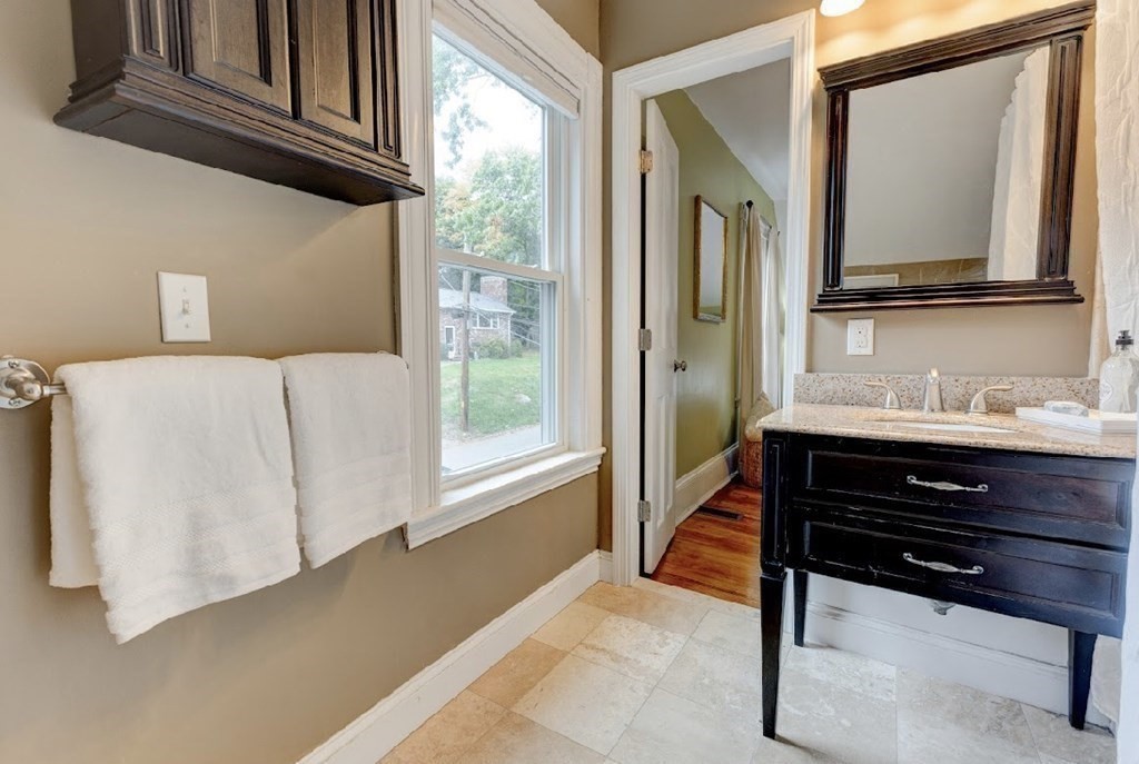 58 Waldo Street Dedham, MA 02026 - Photo 21 of 39 a living room with a dresser and a window