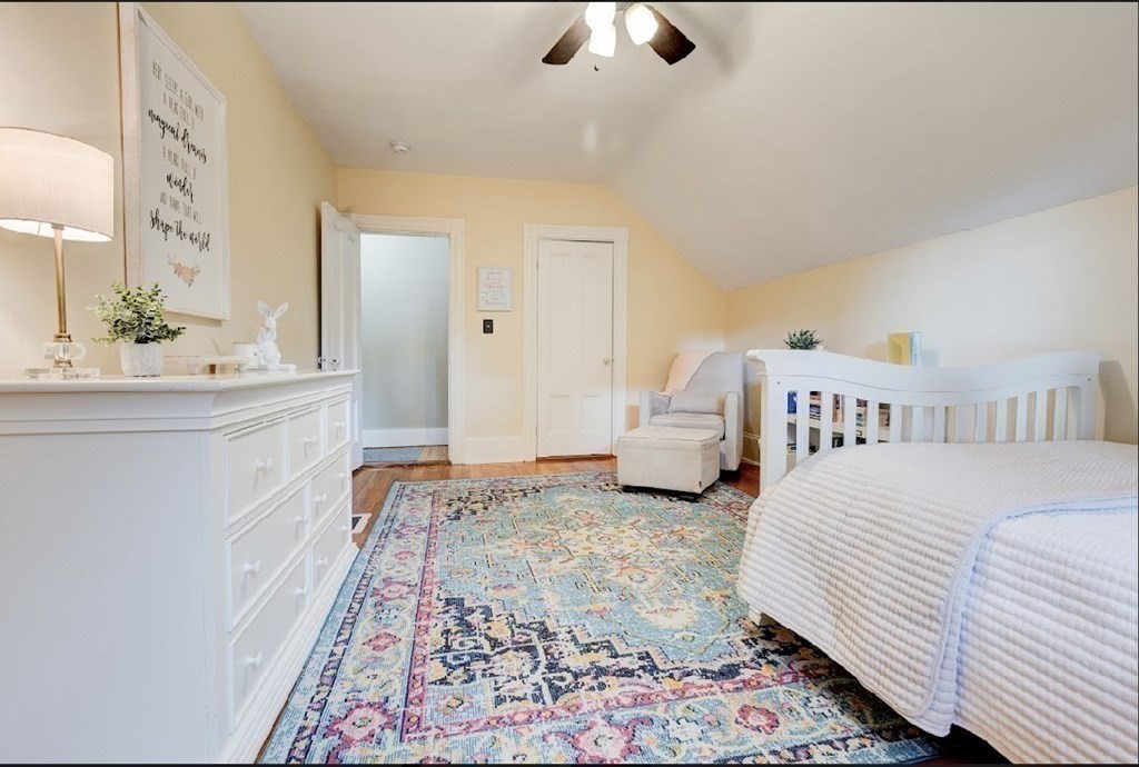 58 Waldo Street Dedham, MA 02026 - Photo 29 of 39 a spacious bedroom with a bed and a cabinets