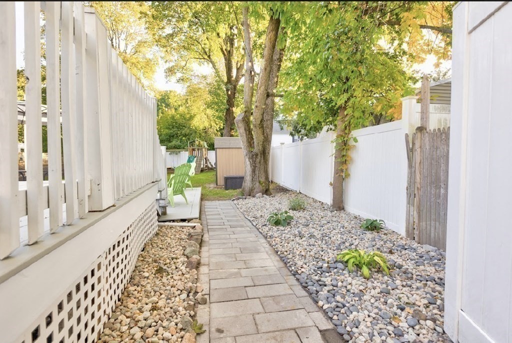 58 Waldo Street Dedham, MA 02026 - Photo 31 of 39 a front view of a house with garden