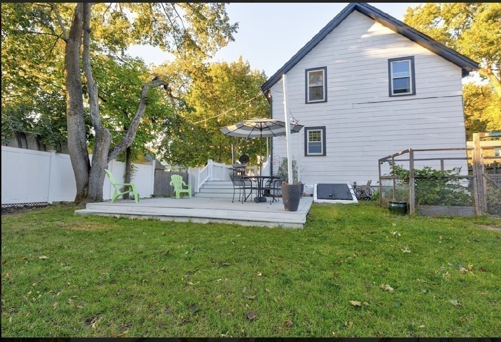 58 Waldo Street Dedham, MA 02026 - Photo 36 of 39 a backyard of a house with table and chairs