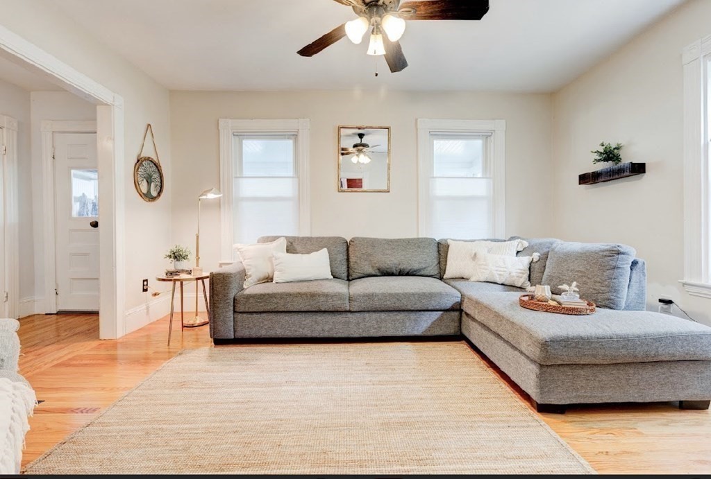 58 Waldo Street Dedham, MA 02026 - Photo 8 of 39 a living room with furniture and a large window