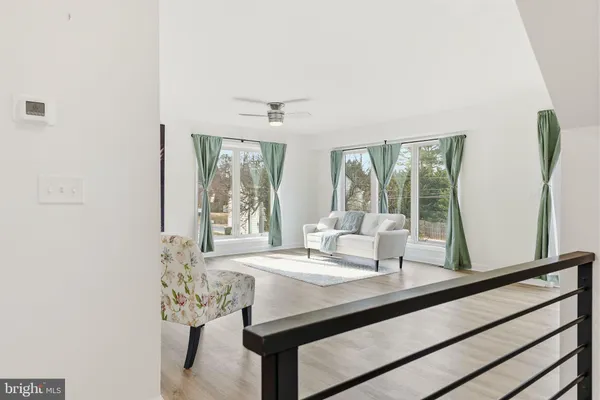 a view of a dining room with furniture and window