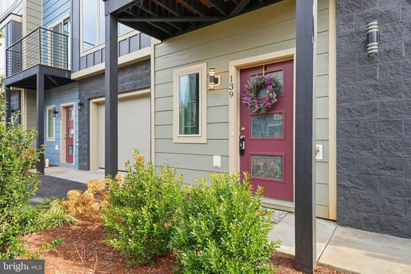 front view of a brick house with a large windows