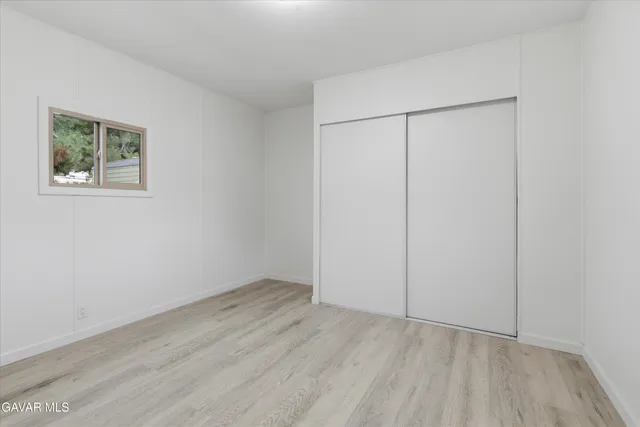 an empty room with a empty space and window