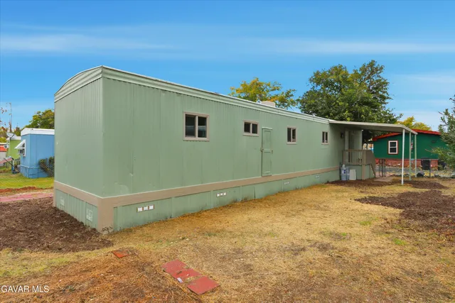 a backyard of a house with seating space
