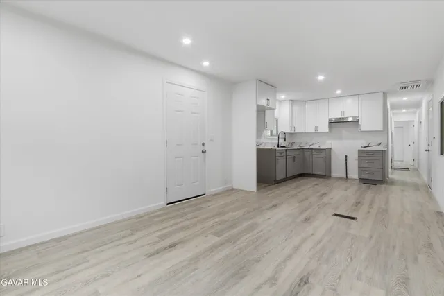 a view of kitchen and wooden floor
