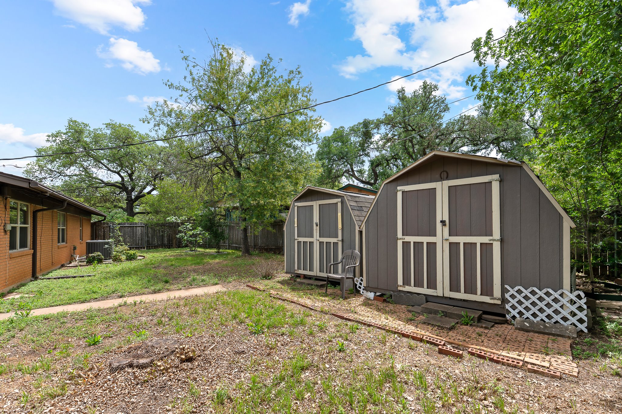 5600 Libyan Circle Austin, TX 78745 - Photo 34 of 37 Fenced backyard with a storage shed