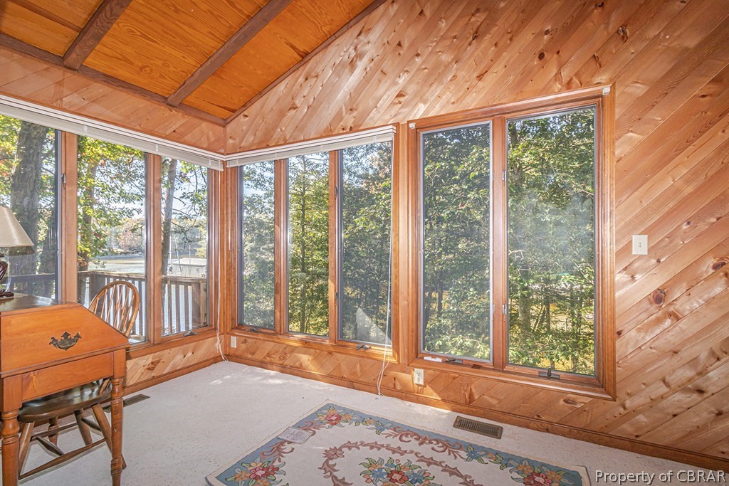131 Ewell Road Lancaster, VA 22503 - Photo 26 of 50 a bedroom with furniture and large windows