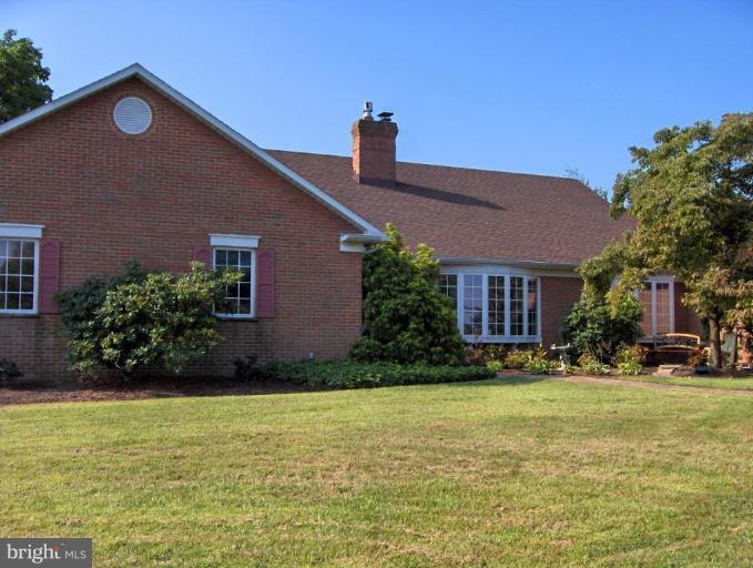 15119 Clear Spring Road Williamsport, MD 21795 - Photo 2 of 30 a front view of house with yard and trees