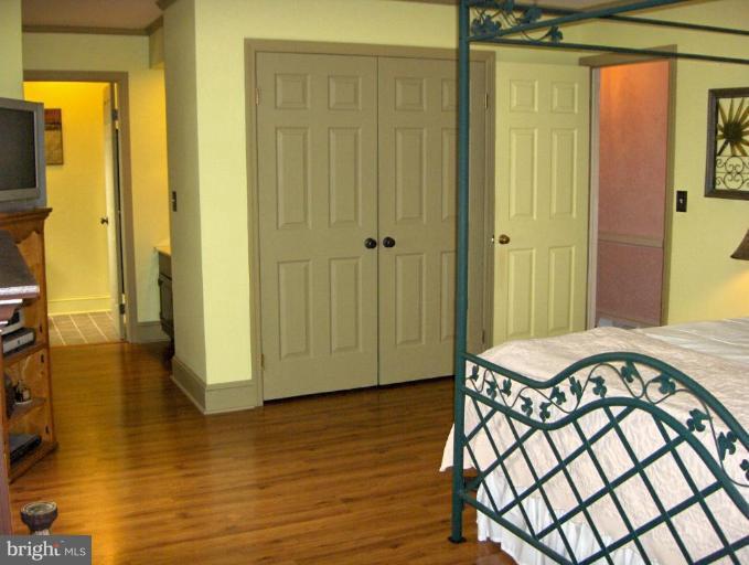 15119 Clear Spring Road Williamsport, MD 21795 - Photo 25 of 30 a view of a bedroom with wooden floor