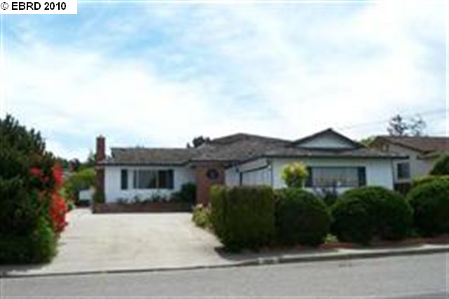 1031 Hawthorne Drive Rodeo, CA 94572 - Photo 1 of 1 a front view of a house with a garden