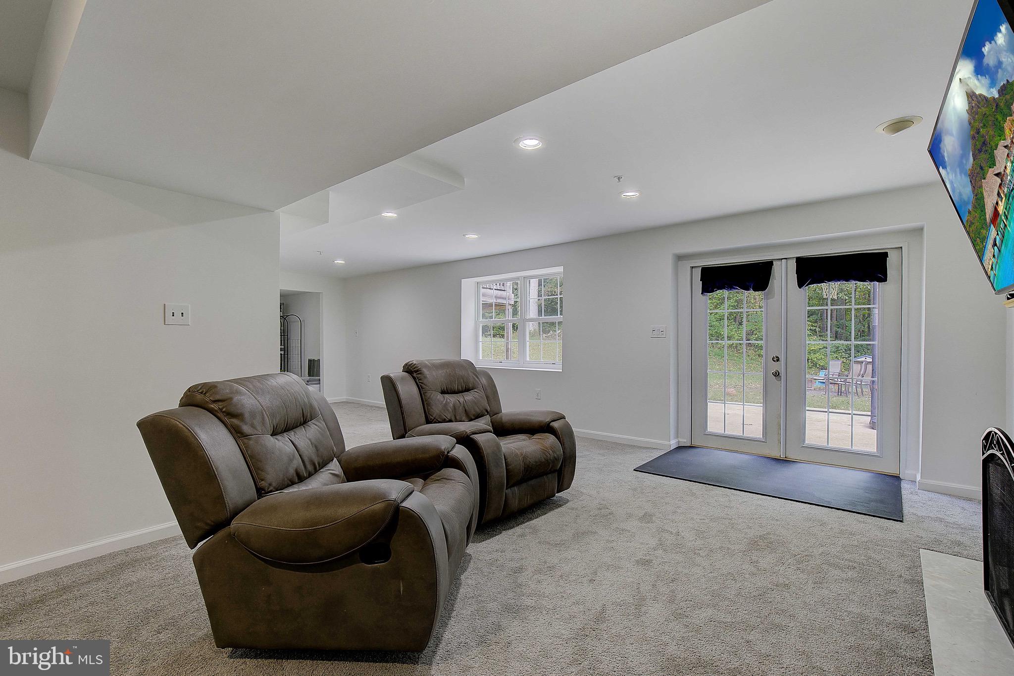 721 Small Reward Road Huntingtown, MD 20639 - Photo 27 of 51 a living room with furniture and a window
