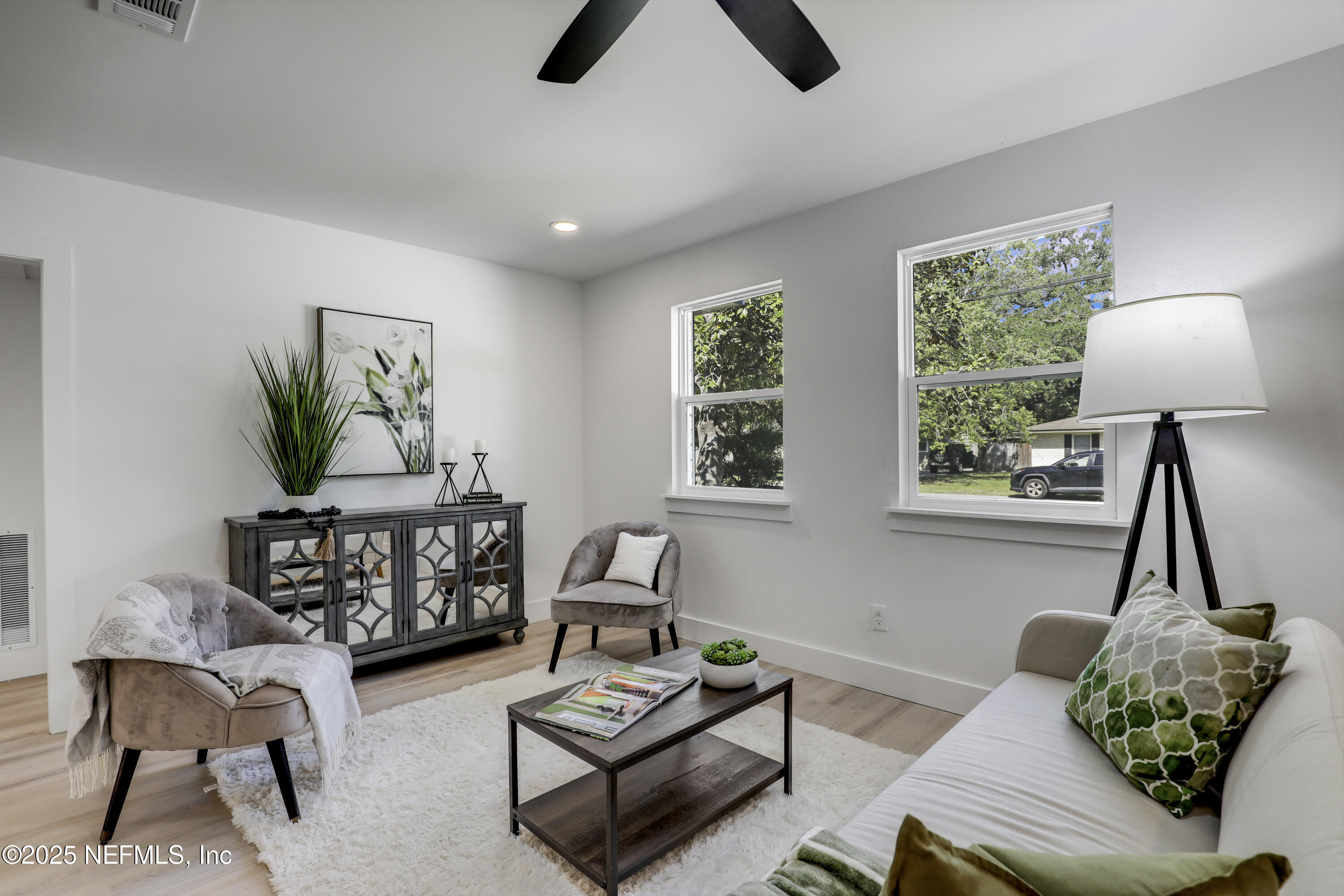 4630 Homestead Road Jacksonville, FL 32210 - Photo 11 of 45 a living room with furniture and a potted plant