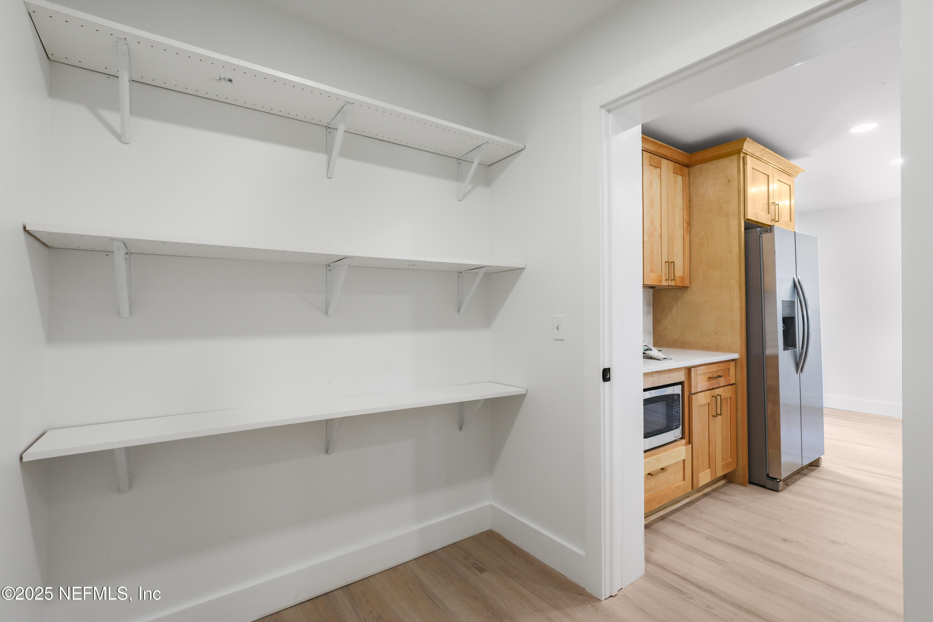 4630 Homestead Road Jacksonville, FL 32210 - Photo 23 of 45 a view of walk in closet with empty racks
