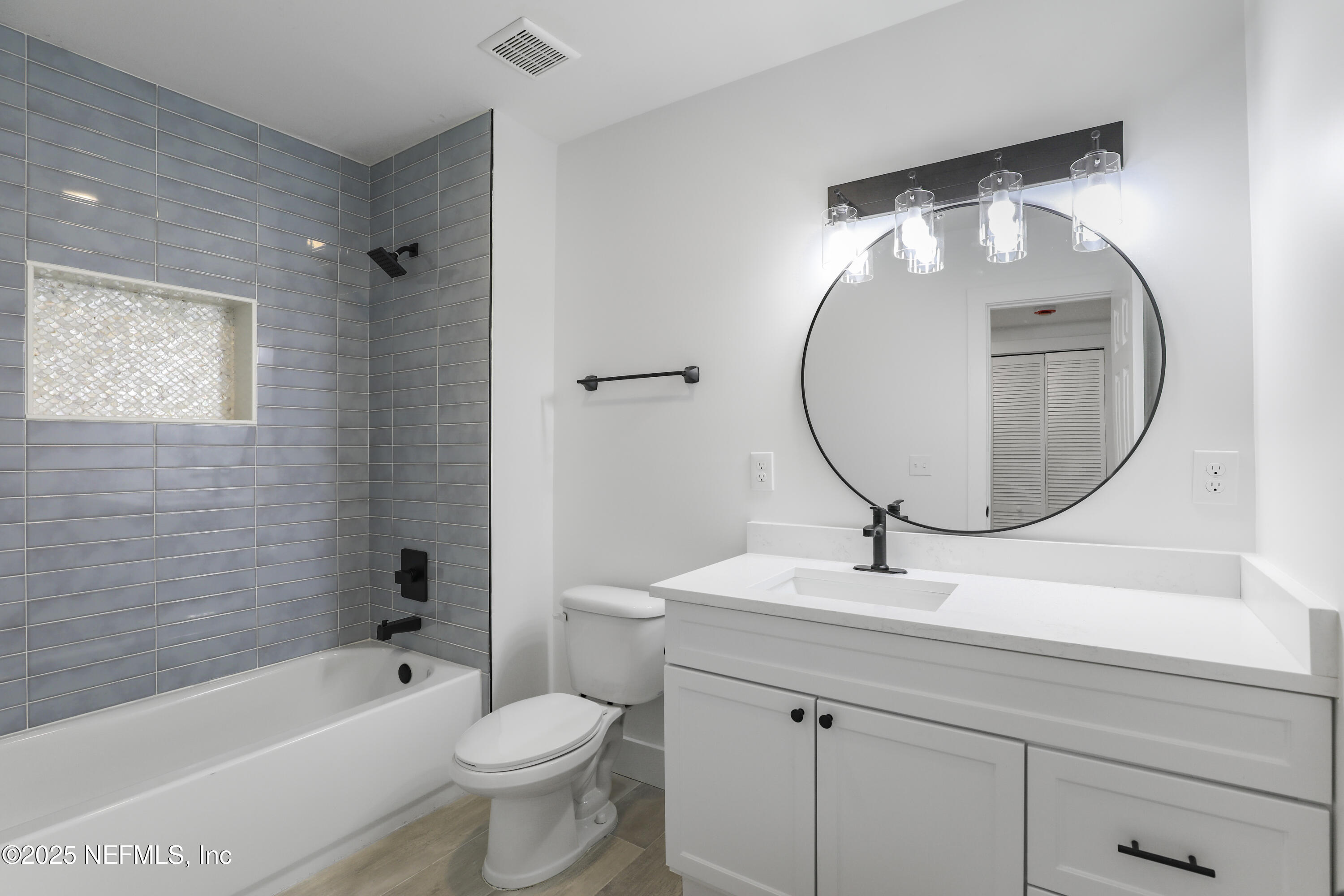 4630 Homestead Road Jacksonville, FL 32210 - Photo 29 of 45 a bathroom with a sink mirror toilet and bathtub