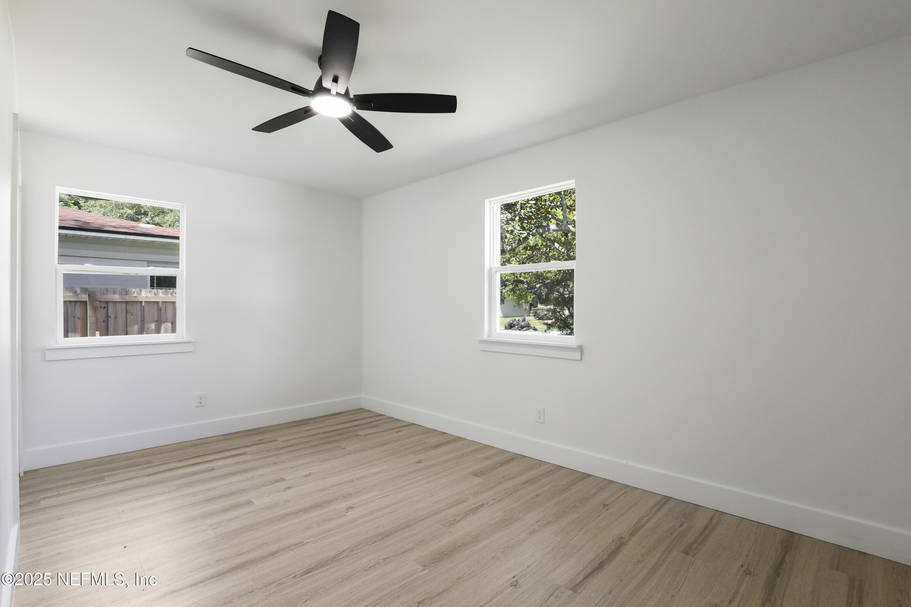 4630 Homestead Road Jacksonville, FL 32210 - Photo 31 of 45 wooden floor in an empty room with a window