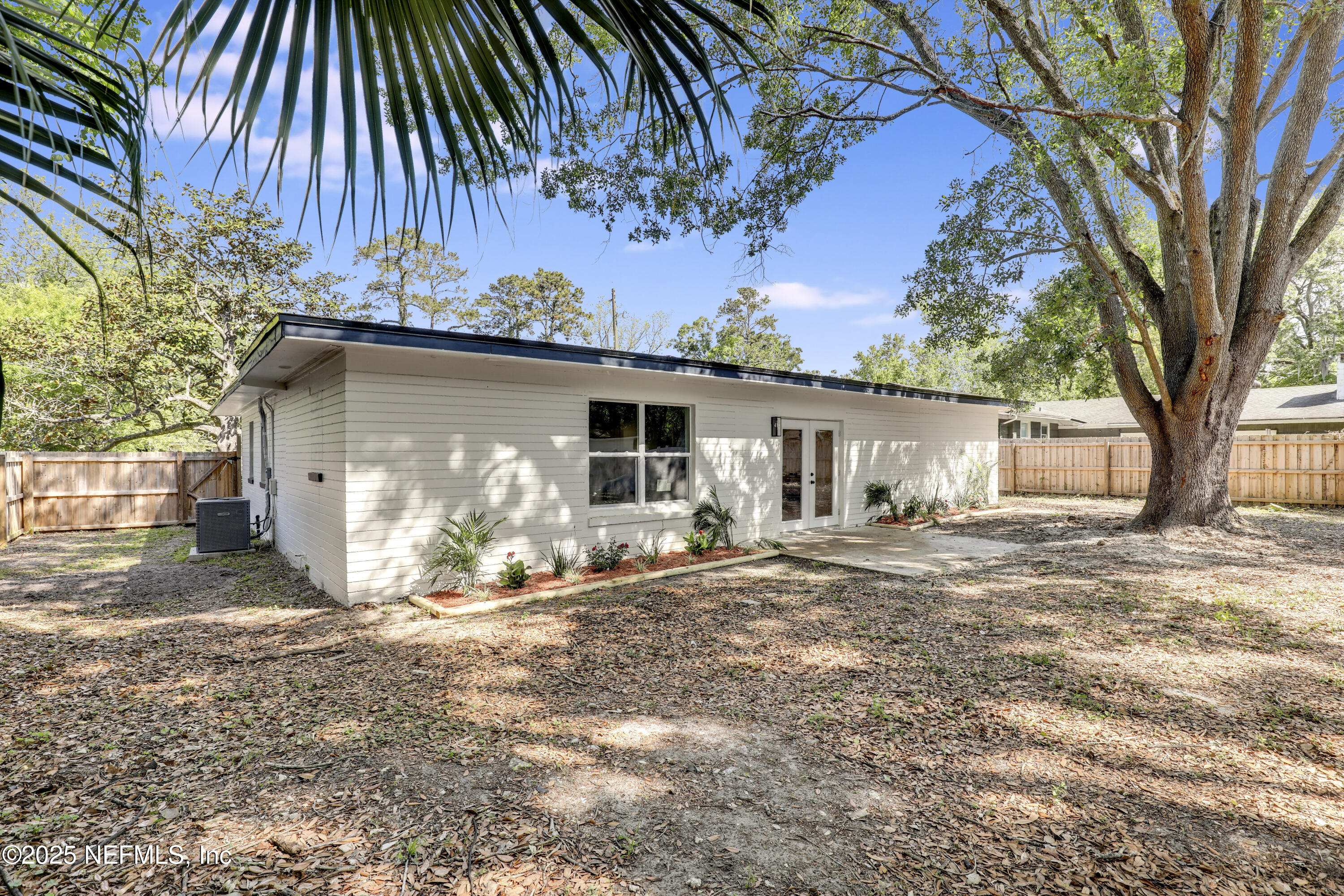 4630 Homestead Road Jacksonville, FL 32210 - Photo 34 of 45 a view of a house with a patio