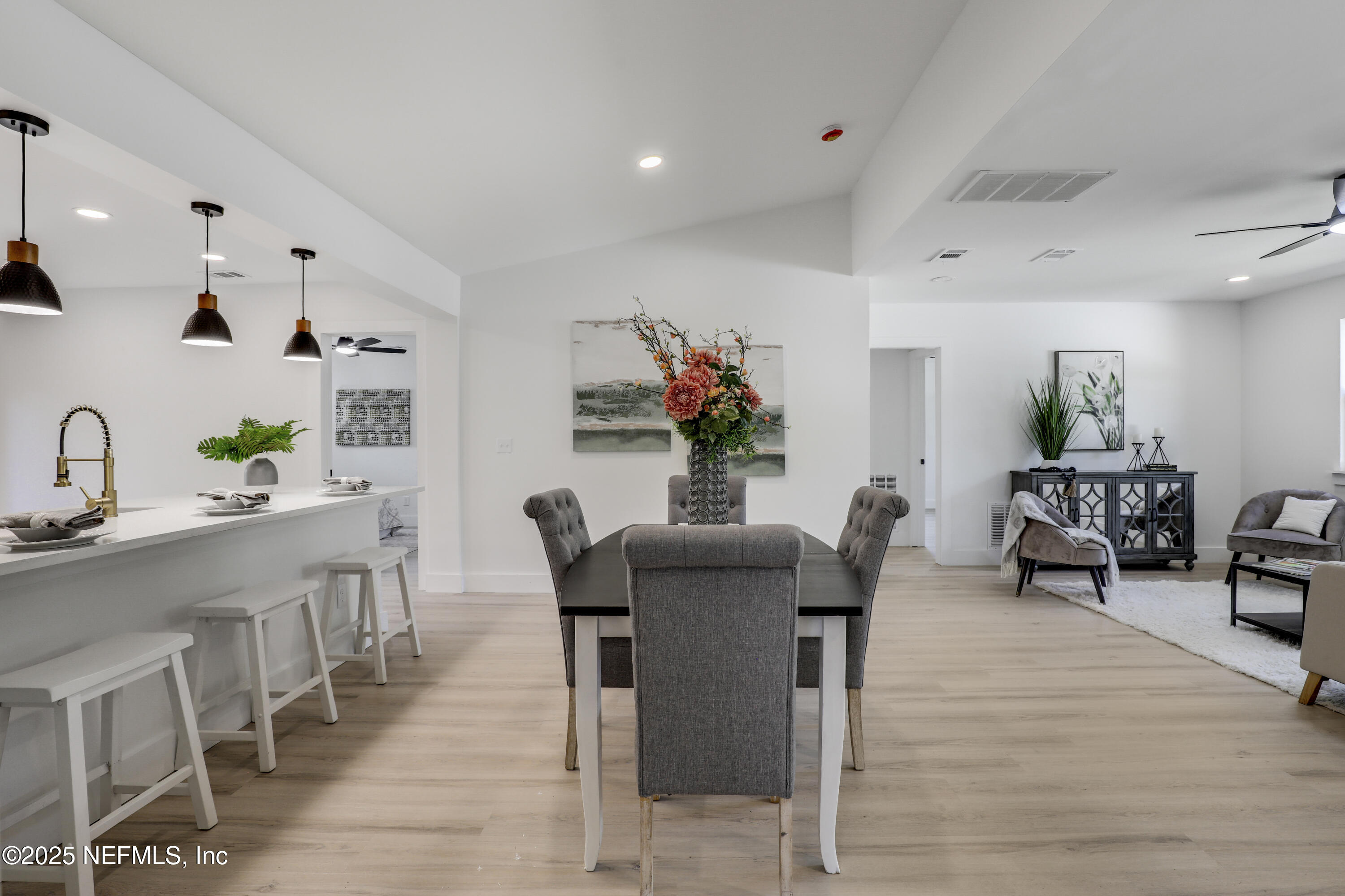 4630 Homestead Road Jacksonville, FL 32210 - Photo 4 of 45 a dining room with furniture and wooden floor