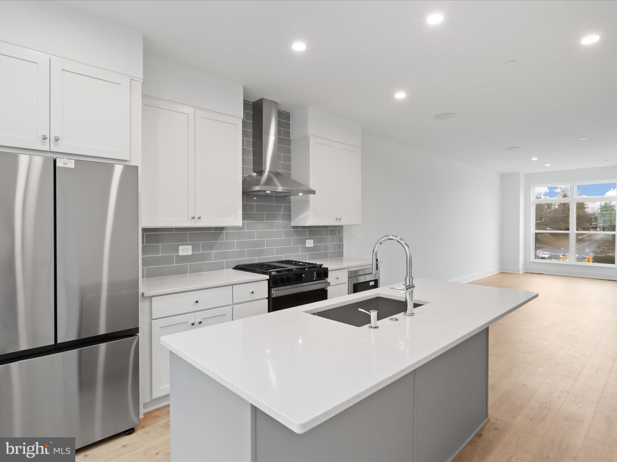 2064 Tysons Ridgeline Road Falls Church, VA 22043 - Photo 13 of 43 a kitchen with stainless steel appliances granite countertop a sink stove and refrigerator