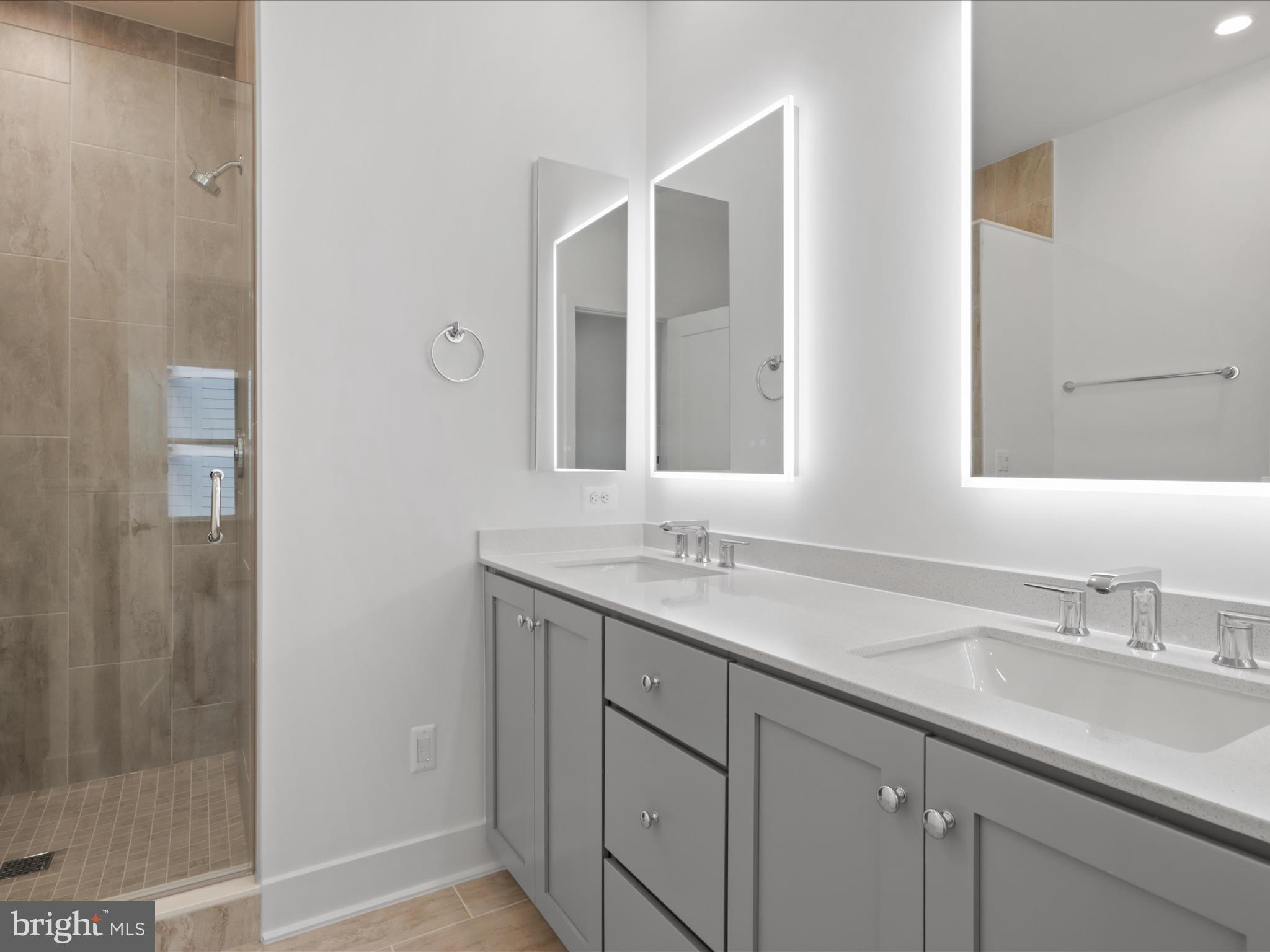2064 Tysons Ridgeline Road Falls Church, VA 22043 - Photo 20 of 43 a bathroom with a granite countertop sink and a mirror