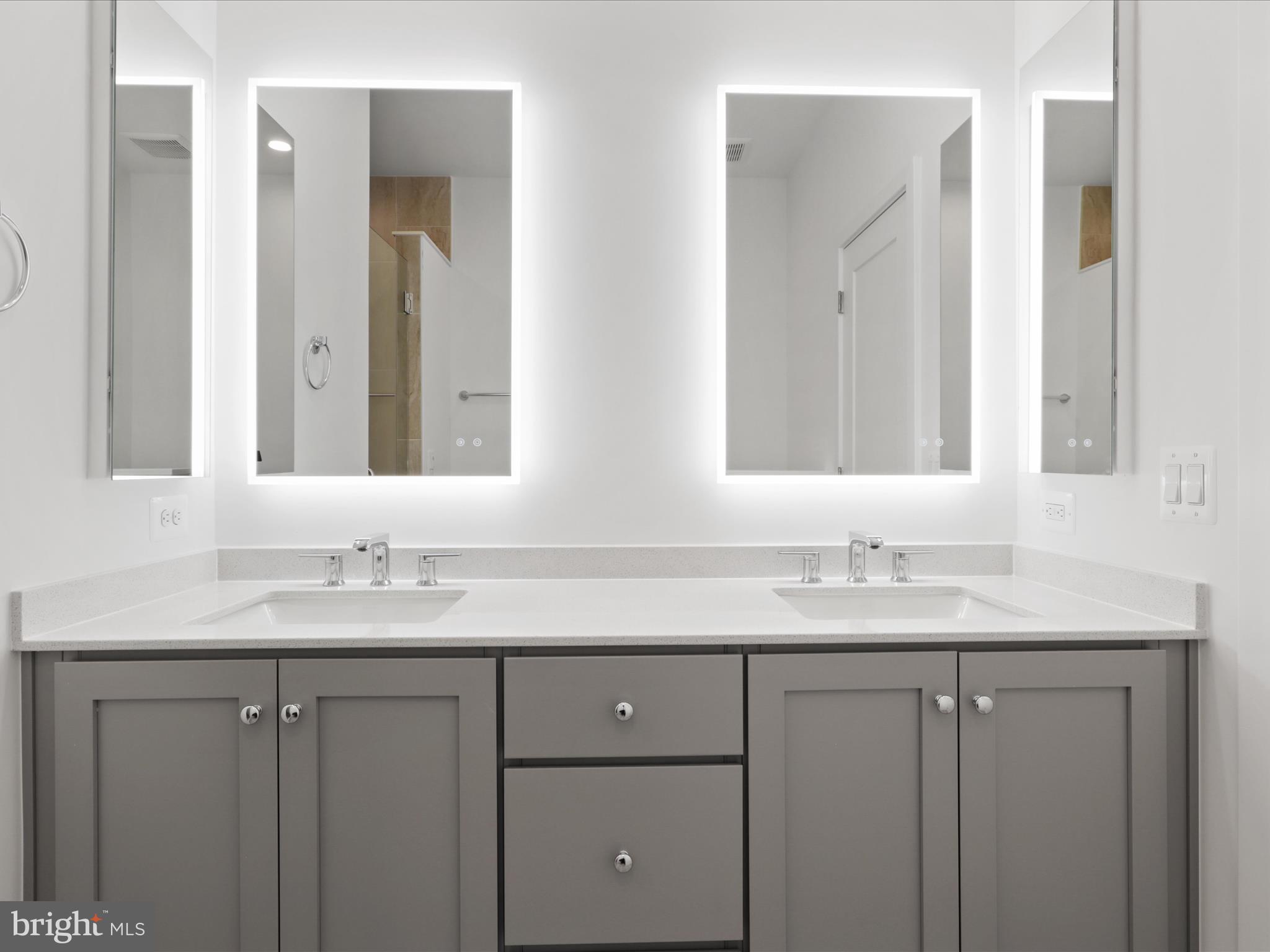 2064 Tysons Ridgeline Road Falls Church, VA 22043 - Photo 21 of 43 a bathroom with double sink and a mirror