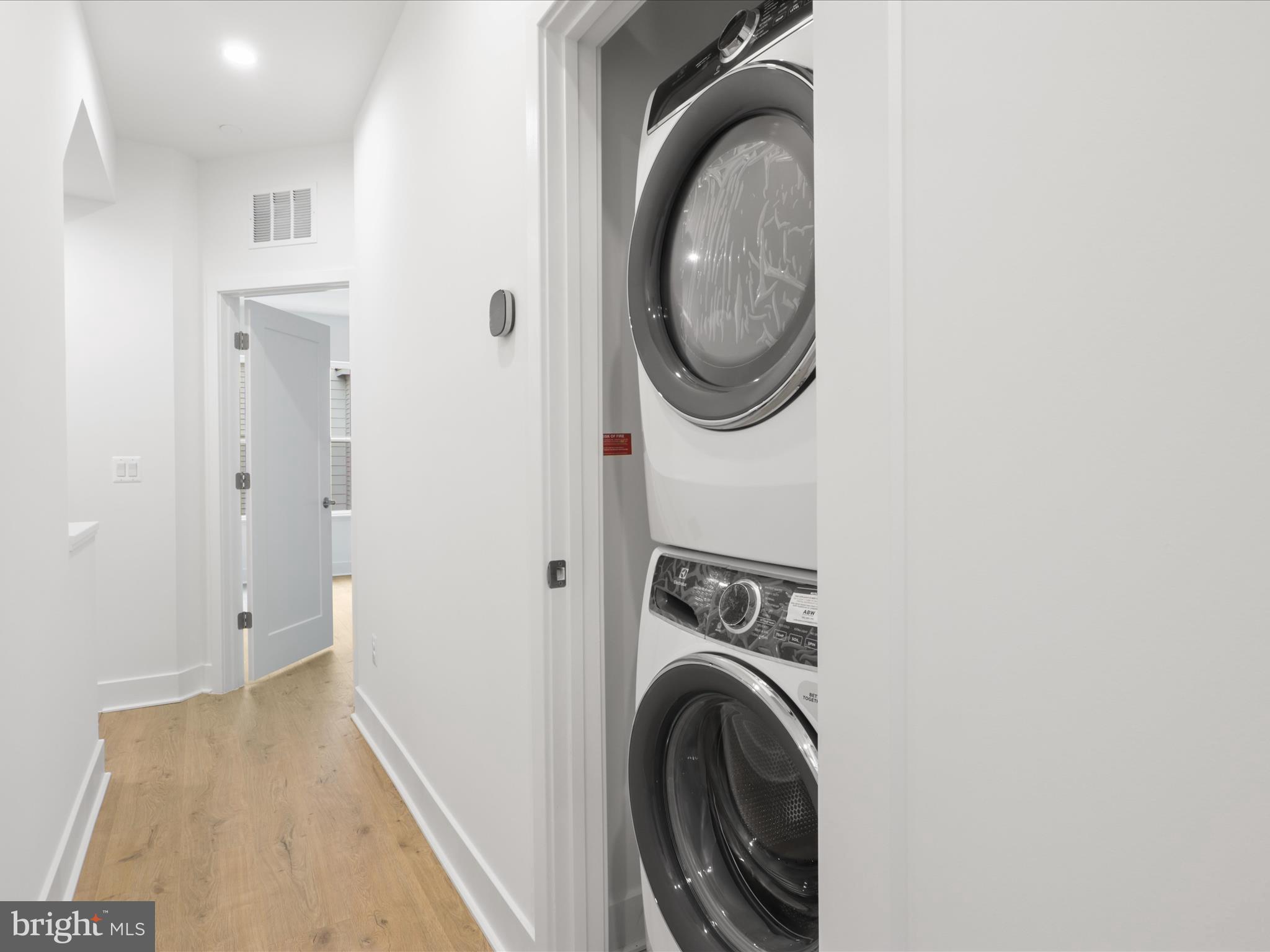 2064 Tysons Ridgeline Road Falls Church, VA 22043 - Photo 23 of 43 a view of a hallway with washer and dryer