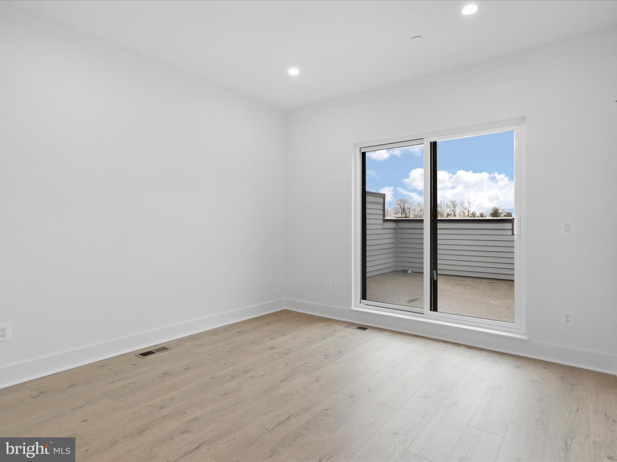 2064 Tysons Ridgeline Road Falls Church, VA 22043 - Photo 27 of 43 an empty room with sliding door