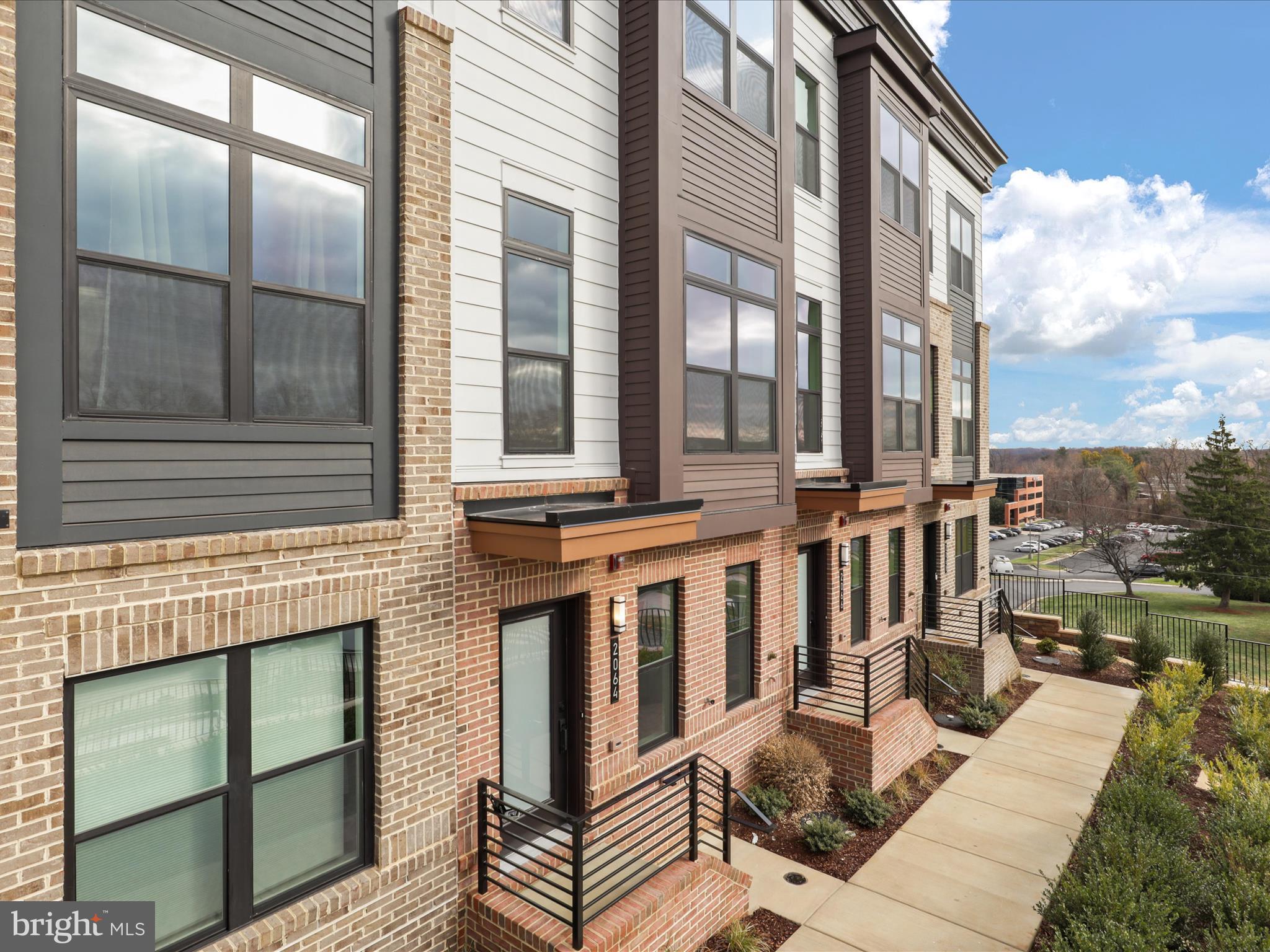 2064 Tysons Ridgeline Road Falls Church, VA 22043 - Photo 3 of 43 a view of a balcony with couches and wooden floor