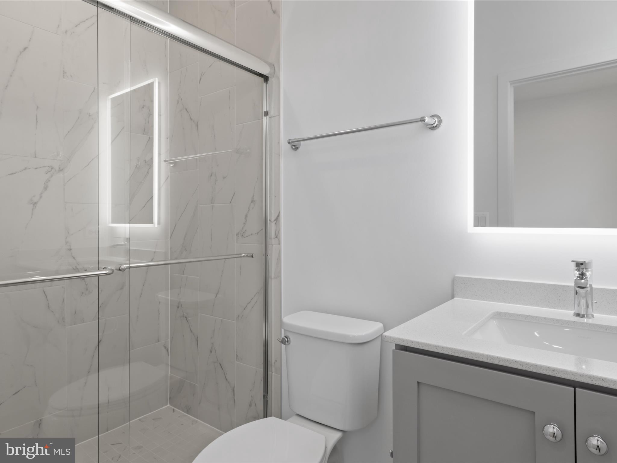 2064 Tysons Ridgeline Road Falls Church, VA 22043 - Photo 32 of 43 a bathroom with a sink toilet and shower