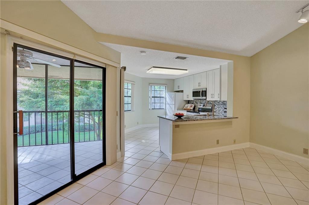 6698 Montego Bay Boulevard, Unit D Boca Raton, FL 33433 - Photo 11 of 44 a room with a large window